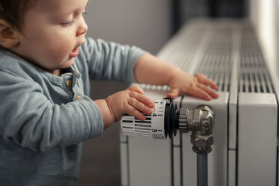Midsection of boy playing piano