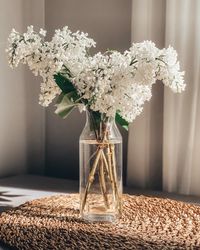 Close-up of flowers in vase on table