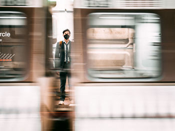 Blurred motion of train at railroad station