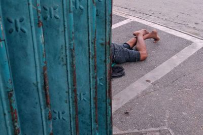 Low section of man lying on floor
