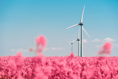 Wind turbine in fantasy land against sky