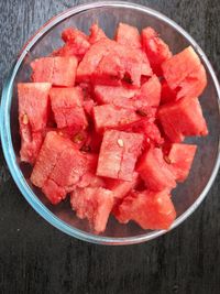 High angle view of chopped fruits in bowl on table