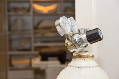 Close-up of light bulb on table