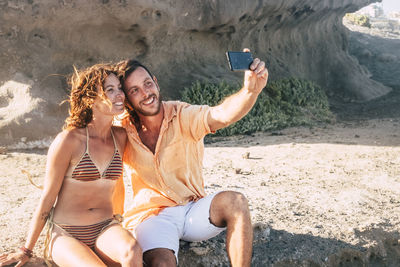 Young couple photographing