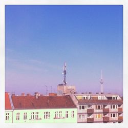 High section of tower against clear blue sky