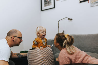 Happy toddler boy sitting in basket