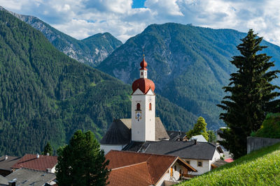 Panoramic view of building and mountains against sky