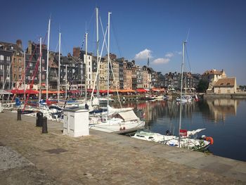 Boats moored at harbor