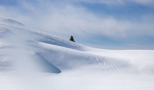 Alpine landscape in winter at alpe d'huez with the mountains covered in snow