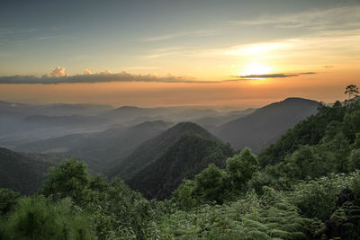 Scenic view of mountains against sky during sunset