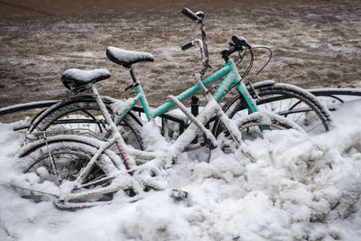 High angle view of abandoned bicycle on snowy field