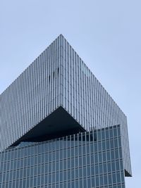 Low angle view of modern building against clear sky