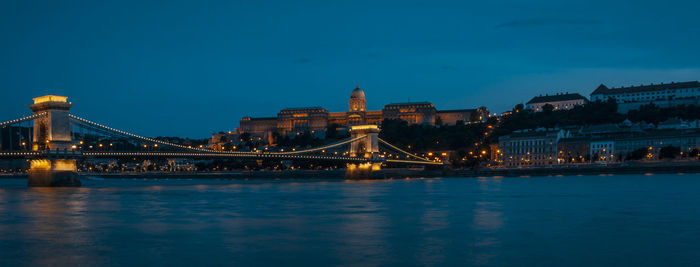 Illuminated bridge over river at night, budapest