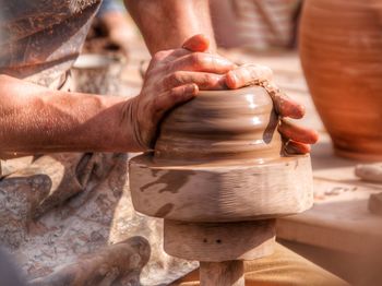 Cropped hands of man working at workshop