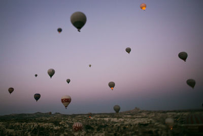 Low angle view of hot air balloons flying in sky capadoccia turkey kapadokya