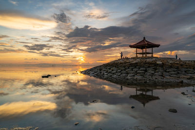Scenic view at karang beach in sanur, bali, against sky during sunrise