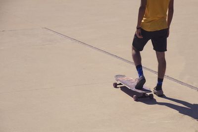Low section of man walking on floor