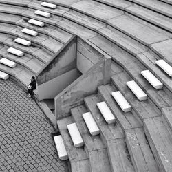 Staircase in front of brick wall