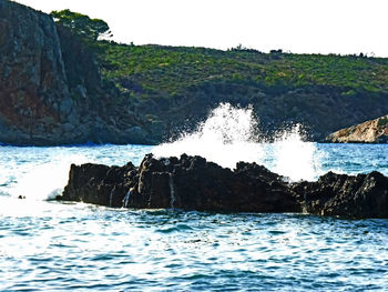 Scenic view of rock formation in sea