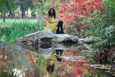 Reflection of woman in lake