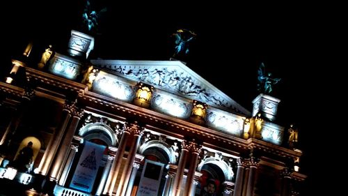 Low angle view of illuminated building at night