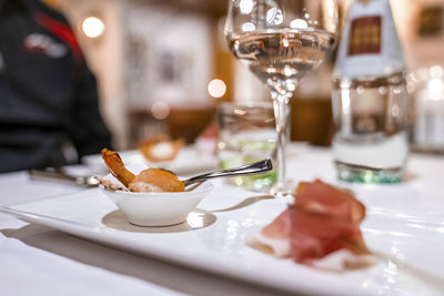 Close-up of delicious seafood served in bowl on dining table at resort