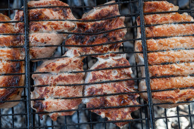 Close-up of meat on barbecue grill