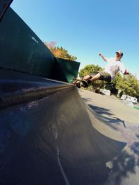 Full length of man skating at park against sky