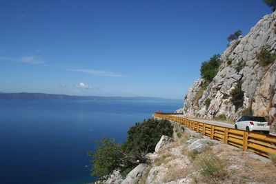 Scenic view of sea against blue sky