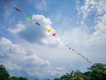Colourful buntings under a cloudy blue skies.