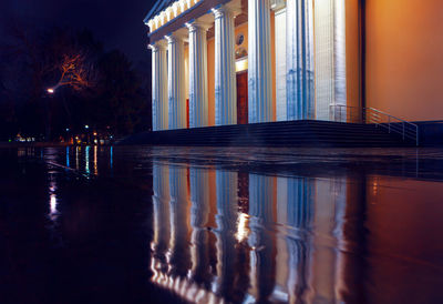 Doric columns of cathedral . architecture of cathedral reflected in the wet pavement 