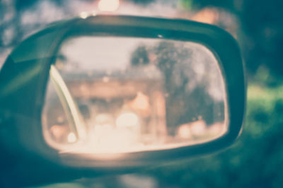 Reflection of camera on side-view mirror of car