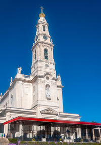 Low angle view of building against blue sky