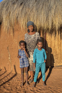 Portrait of a smiling girl standing outdoors