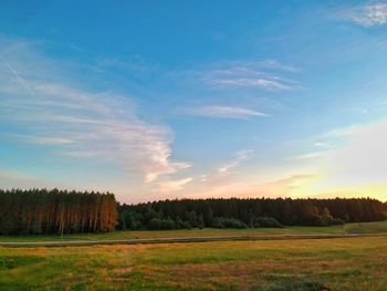 Scenic view of field against sky during sunset