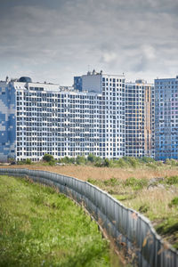 Buildings in city against sky