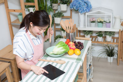 Woman eating food at home