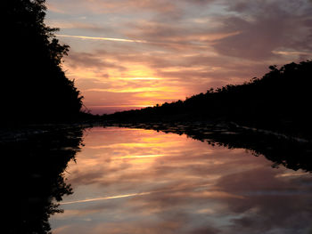 Scenic view of lake against romantic sky at sunset