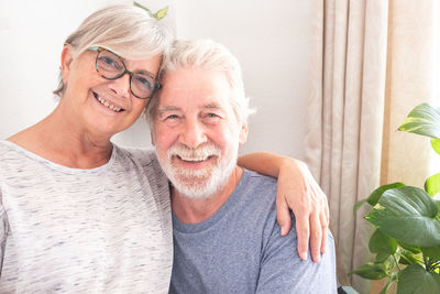 Portrait of smiling senior couple at home