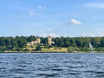 View of potsdam with the castle in park babelsberg  from the water 