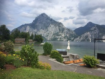 Scenic view of lake and mountains against sky