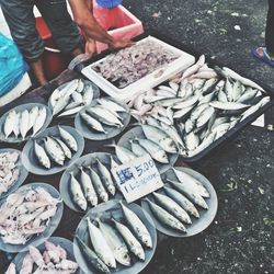 Low section of man having food at market