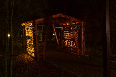 Illuminated entrance of building at night