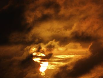 Low angle view of dramatic sky during sunset