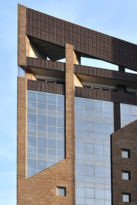 Low angle view of modern building against clear sky