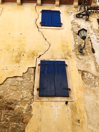 Low angle view of window on old building