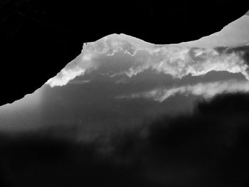 Scenic view of mountains against cloudy sky