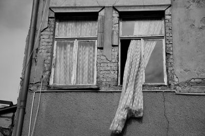 Low angle view of closed window of old building