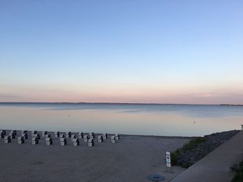 Scenic view of sea against clear sky during sunset