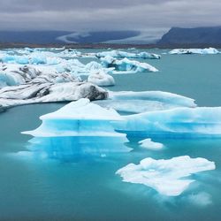 Scenic view of frozen lake against sky